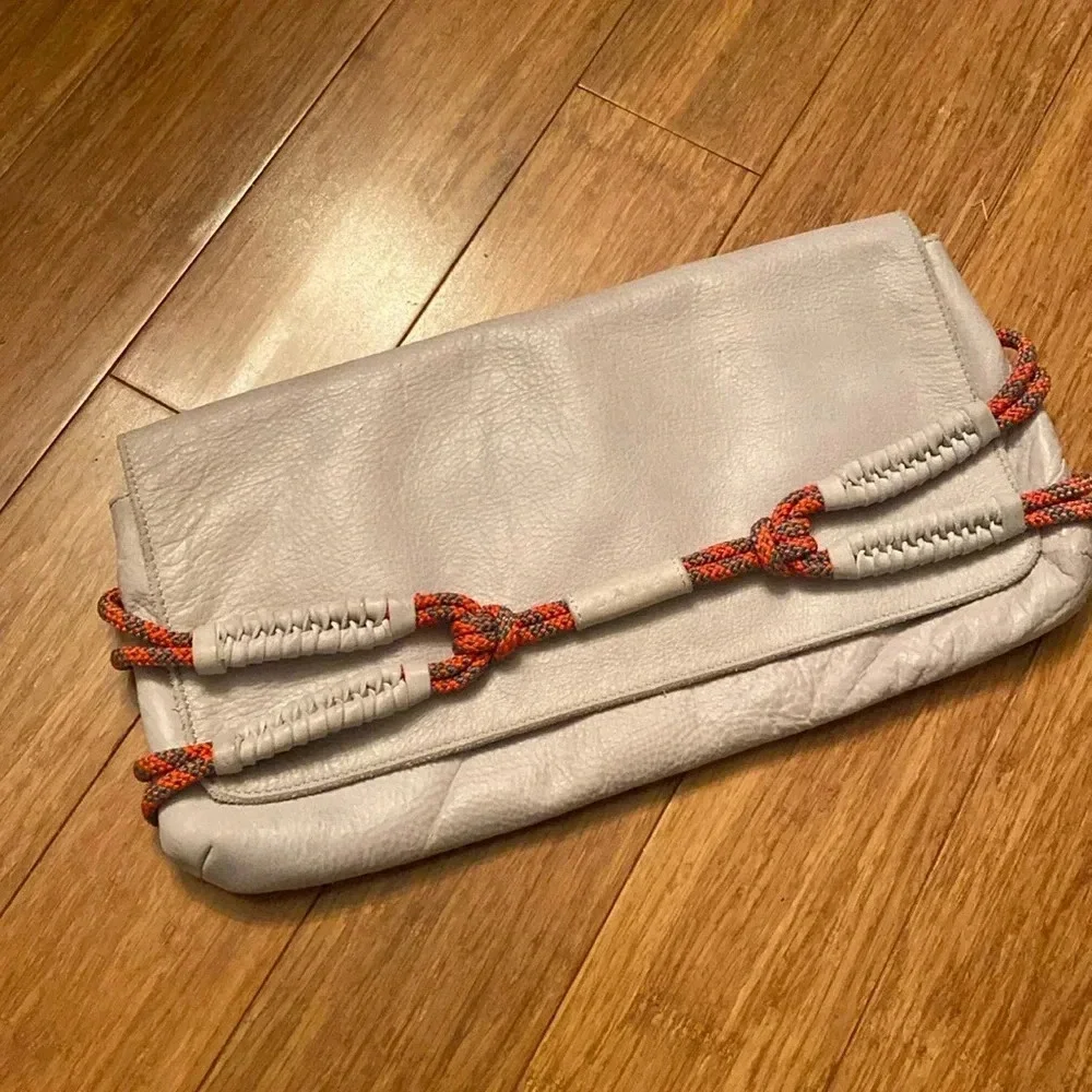 L.A.M.B. By Gwen Stefani gray Leahter clutch -orange rope detail